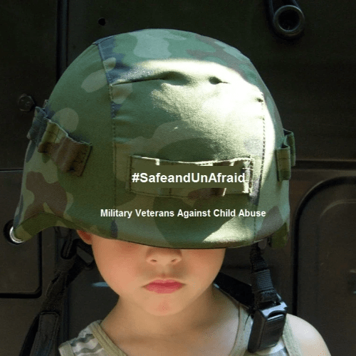 Young child wearing a camouflage military helmet with #SafeandUnAfraid and Military Veterans Against Child Abuse written on it